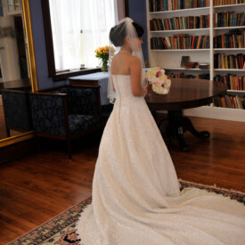 Portrait of bride from behind, with long train