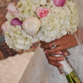 Bridal bouquet with white hydrangeas and various pink flowers